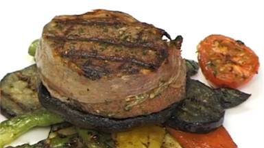 Venison steak with grilled summer vegetables