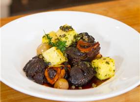 Venison Osso Bucco, slow braised in apple juice with shallots and steamed kumara with lemon, parsley & caper butter