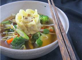 Cervena Venison and Shitake Dim Sum in Aromatic Broth with Steamed Vegetables.